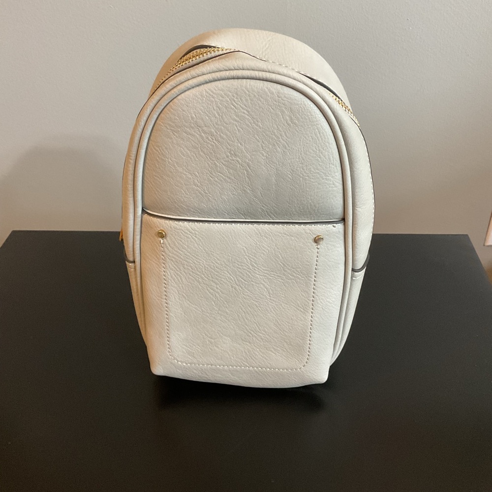 Elegant Small Gray Backpack with Gold Accents